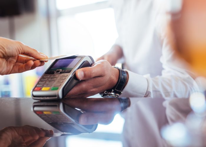 Hand,Of,Customer,Paying,With,Contactless,Credit,Card,With,Nfc